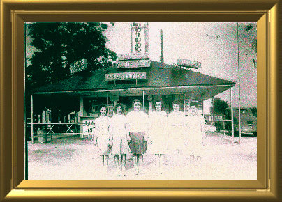 employees of the blue top standing in front of building late 1940's